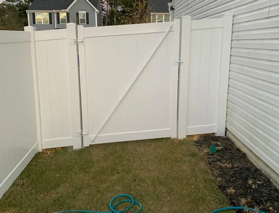 White Vinyl Fence with Metal Gate Brace