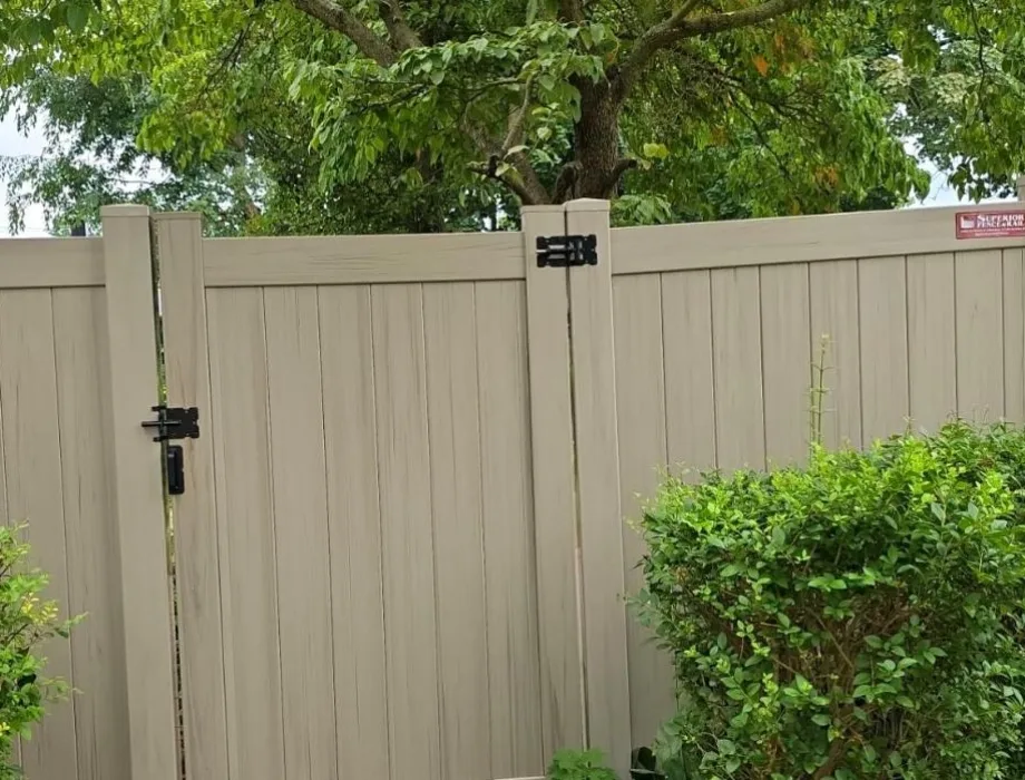 Tan Vinyl Privacy Fence with Gate