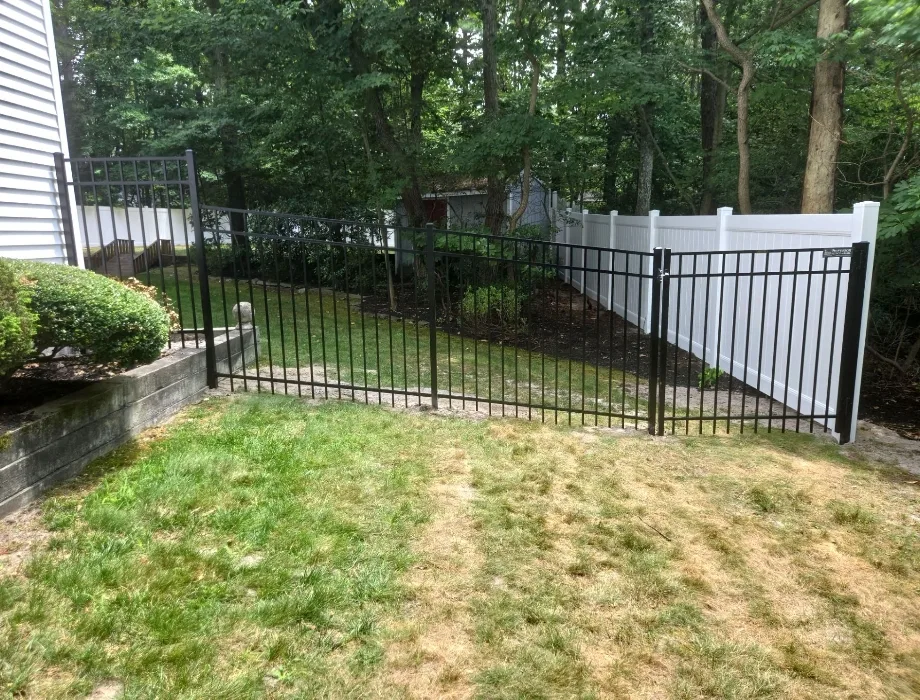 5'H Black 300 Sterling (R) Black Aluminum Fence and White Vinyl Privacy Fence